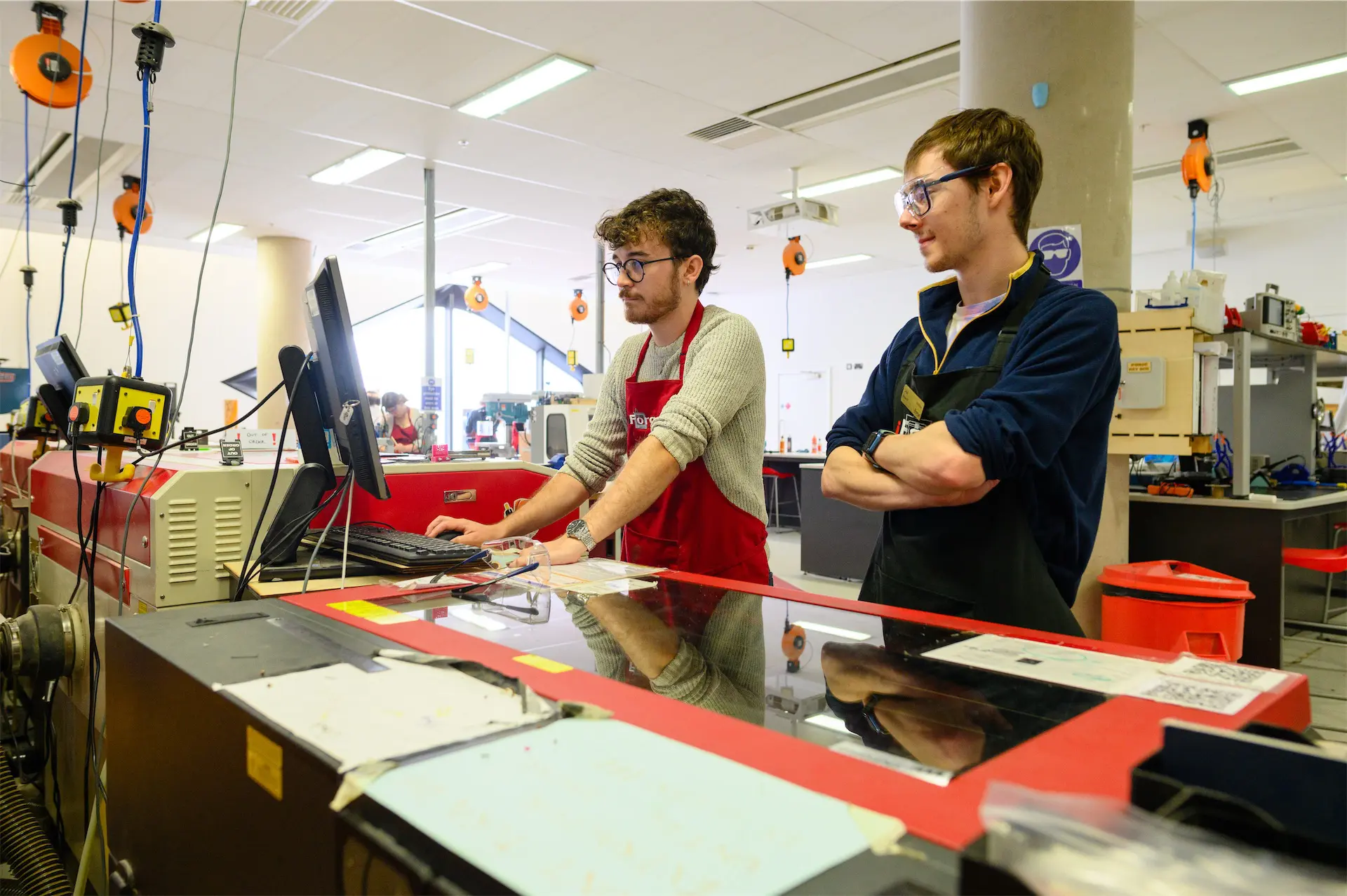Users using a laser cutter
