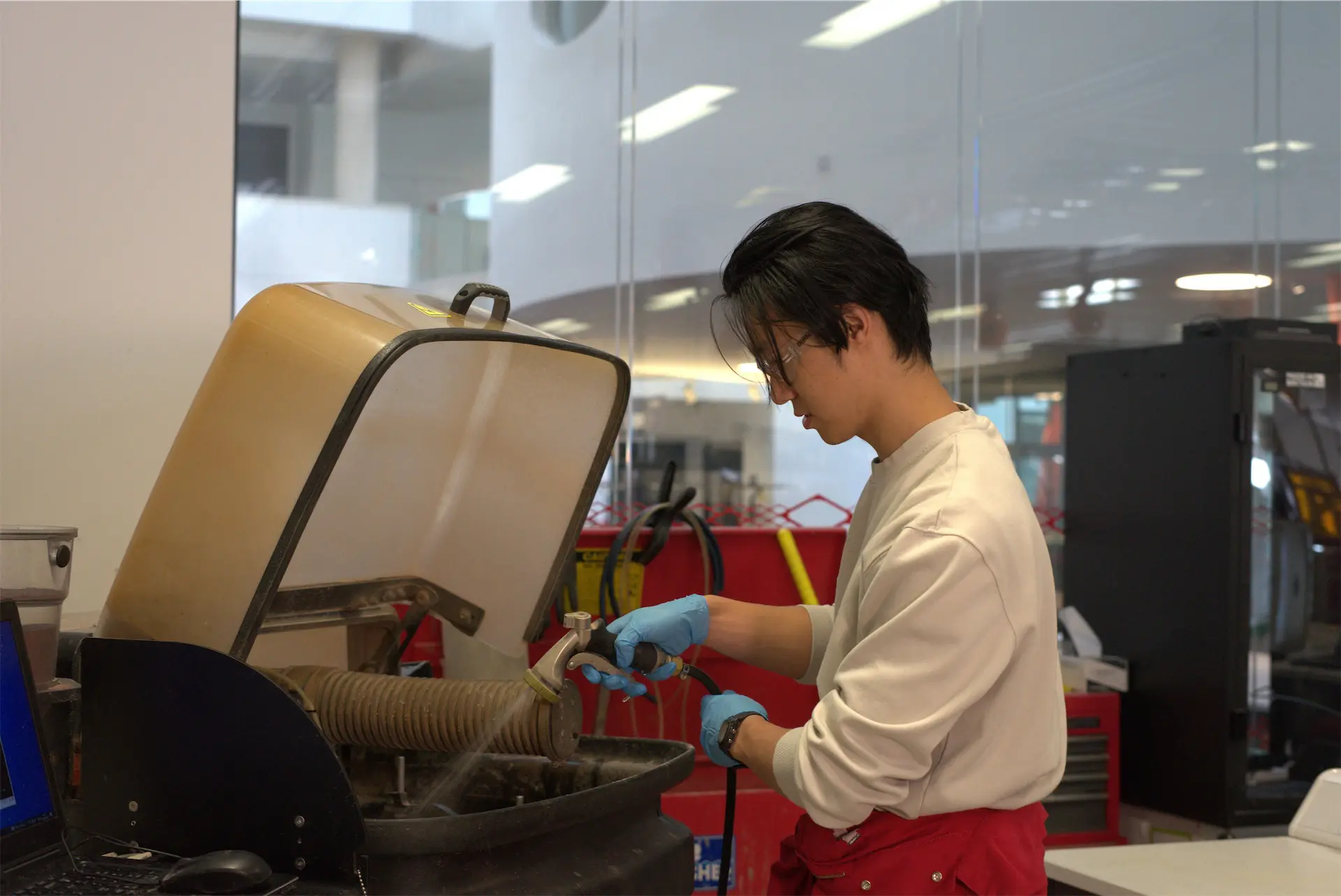 Users using the water jet cutter